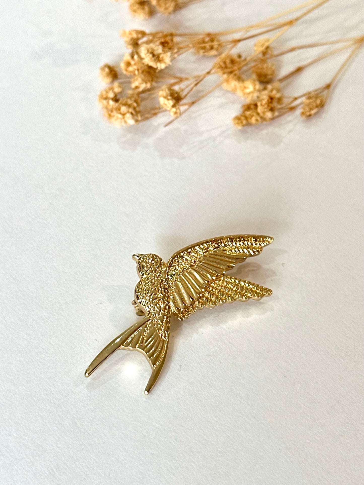 Broche golondrina