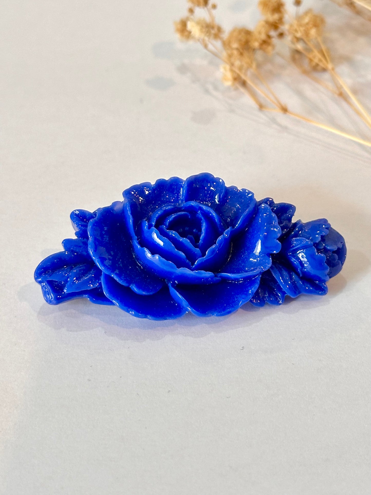 Broche rosa azul eléctrico