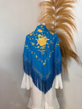 Mantoncillo azul bordado dorado