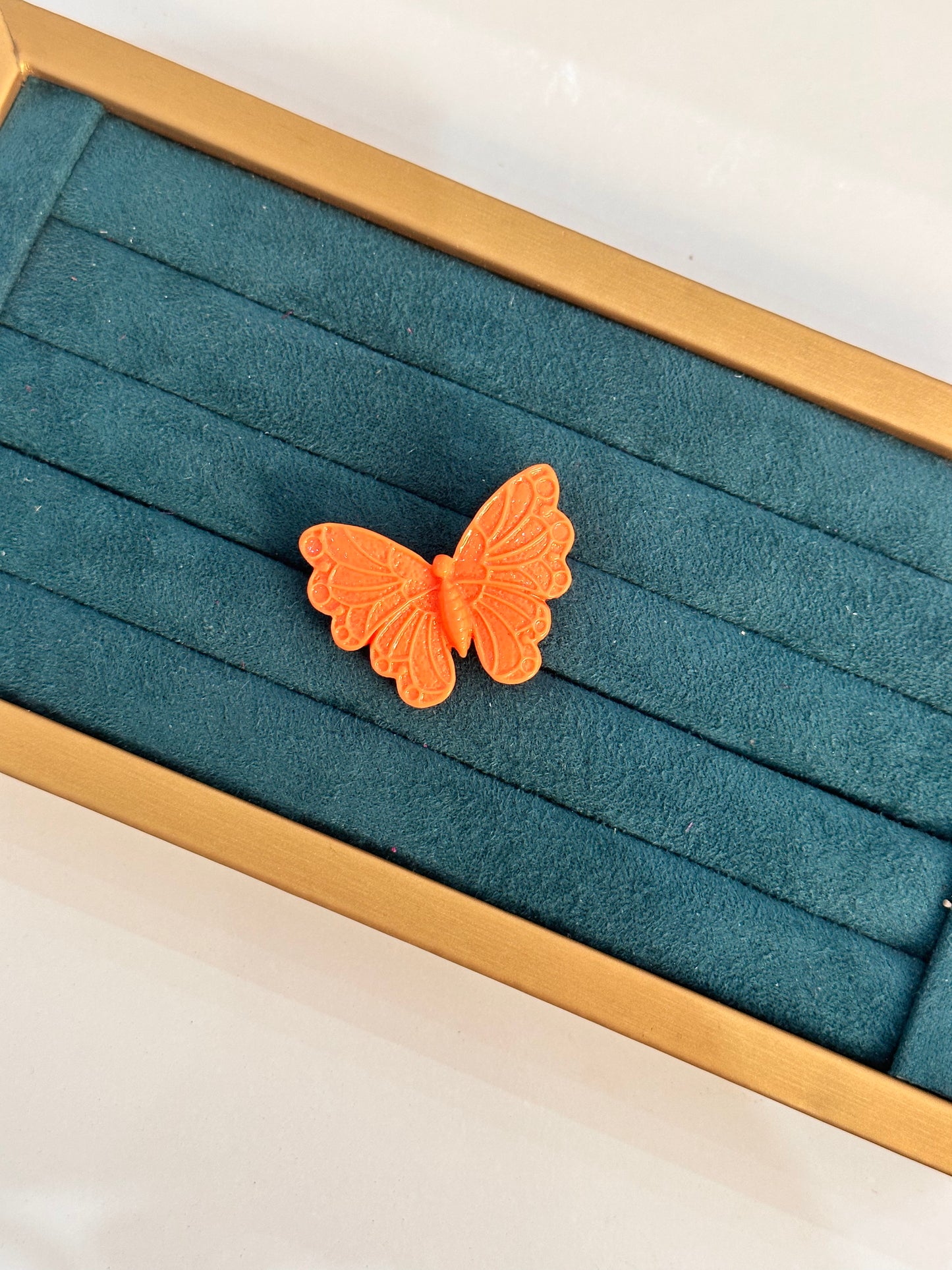 Broche mariposa naranja